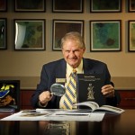 Claude Baker with book