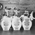 The 1937-38 Varsitonians at the Club House, front row, left to right: Billy Bennett, Henry Mize, Walter Whitlow Stokes, James Van Sweden, and Charles E. Haydon; back row, l. to r.: Albert Prator, Roy Lewis, Sidney Smith, J. W. Gladney, and Bob James. Three musicians who went to France not shown: Harold Gilbert, Herbert Lawrence, and Harold Hunsaker.